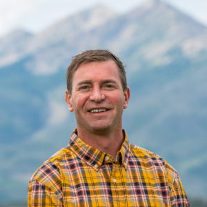 Summit Resort Group Real Estate Broker Mark Conley on Lake Dillon with Peak 1 in the background