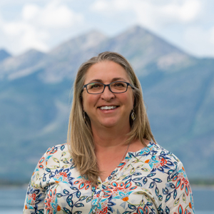 Summit Resort Group Real Estate Broker Sam Meister on Lake Dillon with Peak 1 in the background